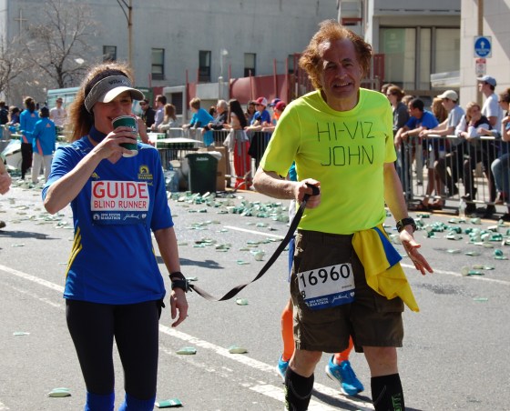 A visually impaired runner and his guide
