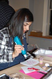 Rachna working the embossing gun
